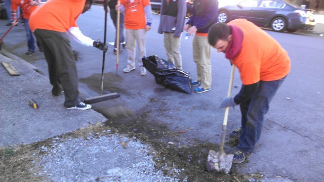 Some of the volunteers got the thrilling job of scraping dirt and weeds off the empty lot and curb. Amazing what a difference it made.